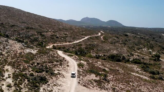 Aerial view of a car driving on a dirt road on Kos island