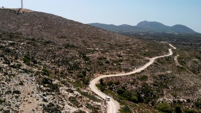 Aerial view of a car driving on a dirt road on Kos island
