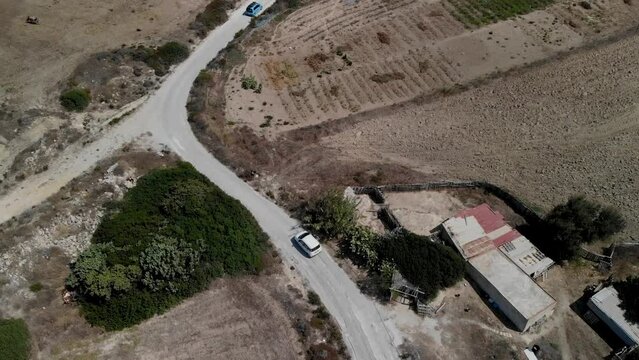 Aerial view of a car driving on a country road on Kos island