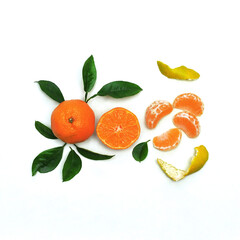 Fresh tangerines  with leaves and slices  isolated on a white background.Free space for writing.Top view