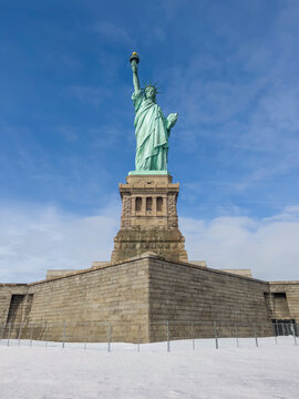 Statue Of Liberty In New York City In USA During Winter With Snow