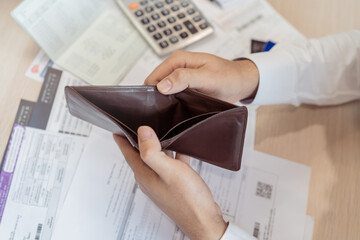 Stressed, Problem business person man, male holding and open an empty wallet not have money, credit card, not to payment bill, loan or expense in pay. Bankruptcy, bankrupt and debt financial concept.