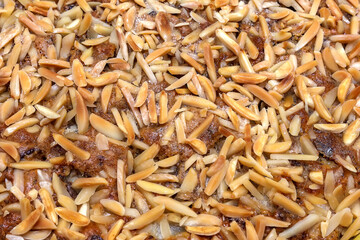 the surface of the cake with finely chopped almonds. Close up