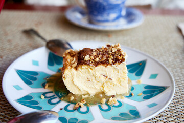 Pie. Piece of baked cheesecake with compote and almonds