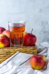 apple juice and red apples in basket