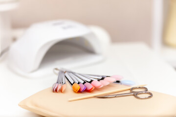 manicure and pedicure equipment for nail bar set on light background