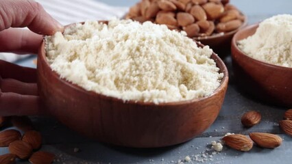 Alternative keto diet gluten grain free flour. Paleo and ketogenic diet baking cooking concept. Almond flour with whole nuts