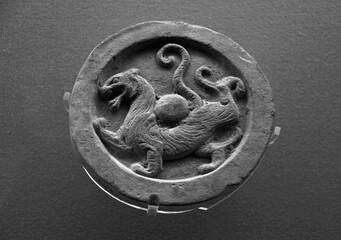 Circular tile animal totem carving in Han Dynasty of China