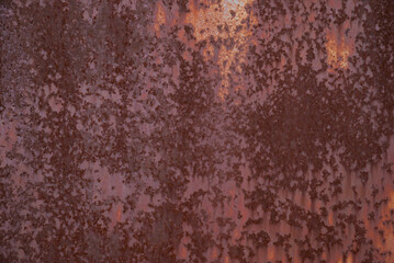 Rusty iron. The texture of the old rusty metal sheet. Closeup.