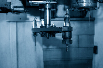 The  Automatic Tool Change (ATC) operation with swing arm.