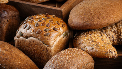 Closeup on assorted variety of fresh baked loaves of bread