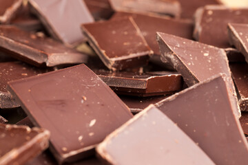 a chocolate bar broken into more pieces