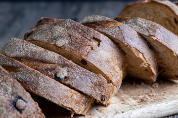 fresh cut bread made of flour and dried cranberries