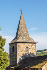 Fototapeta na wymiar Clocher de l'église Saint-Martin de Jaleyrac - 12ème siècle - Cantal