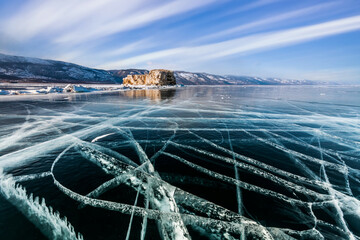 Transparent ice on Lake Baikal in winter. Siberia, Russia.