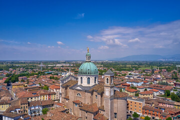 Fototapeta na wymiar Historic Italy aerial view. Italian church aerial view. Historic churches of Italy top view. Italian city aerial view. Parrocchia Santa Maria Assunta view from above.