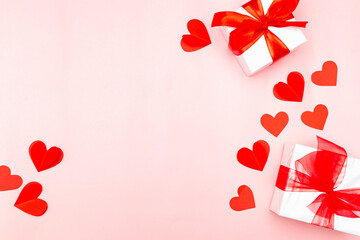 Valentine's Day. Gifts, hearts on rose background. Concept of love and affection. Holiday card.