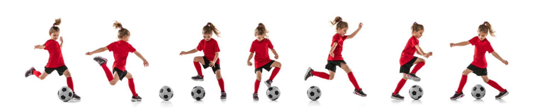 Full-length portrait of little girl, child, training, playing football isolated over white background. Collage