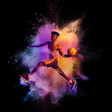 Collage. Portrait of professional basketball player in playing, training isolated over black background with colorful powder explosion