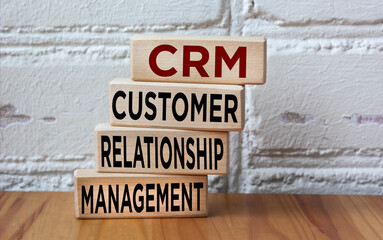CRM Customer Relationship Management System, text on wooden blocks