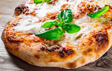 flatbread roman Pizza with Mozzarella cheese, Tomatoes, pepper, Spices and Fresh Basil. Italian pizza. Pizza Margherita or Margarita on wooden background
