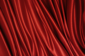Beautiful elegant wavy hot red satin silk luxury cloth fabric texture with monochrome background design. Wallpaper, banner or card with copy space.