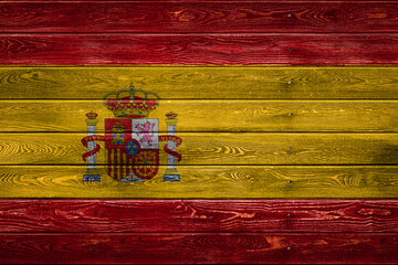 The national flag of Spain is painted on a camp of even boards nailed with a nail. The symbol of...