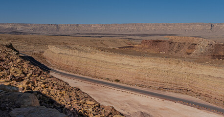 View of an old, restored former a Quarry in the heart of the Ramon Crater and Mount Ardon in the background, located near Mitzpe Ramon, South of Beer Sheba in the Negev Desert, Israel	
