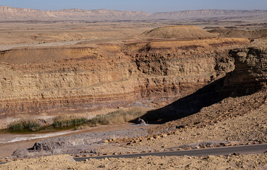View of an old, former and restored  Quarry in the heart of the Ramon Crater and Mount Ardon in the background, located near Mitzpe Ramon, South of Beer Sheba in the Negev Desert, Israel	