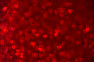 Red hearts, sparkling glitter bokeh background, valentines day abstract defocused texture