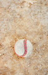 Fototapeta na wymiar Get out and play some baseball. Still life shot of a baseball ball on the pitch outdoors during the day.