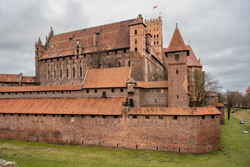 Obraz premium The medieval Castle of the Teutonic Order in Malbork in the Pomerania region, Poland. This is the largest castle in the world measured by land area and a UNESCO World Heritage Site