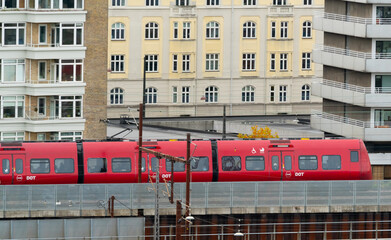 Local train rushing through the city of Copenhagen.