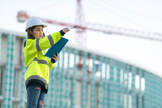 Asian engineer working at site of a large building project,Thailand people,Work overtime at construction site