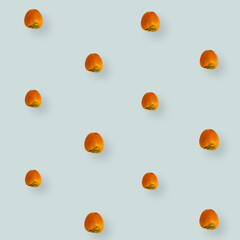 Colorful fruit pattern of fresh persimmons on light grey background. Top view. Flat lay. Pop art design