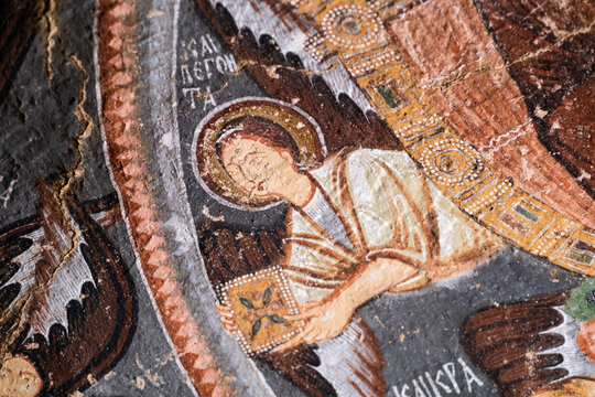 Old religious painting on cave church wall in Cappadocia, Turkey