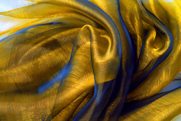 golden color organza fabric macro wavy