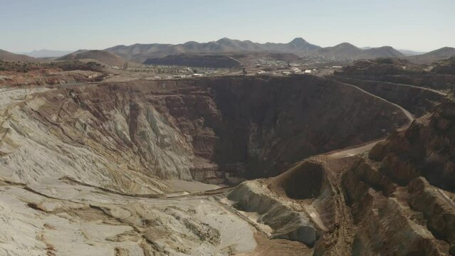 Aerial flight over the Queen mine in Bisbee Arizona.  This is an very large open pit mine.