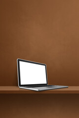 Laptop computer on brown shelf. Vertical background