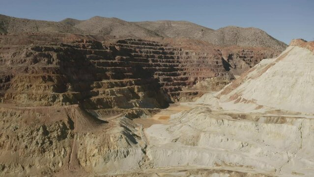 Aerial flight over the Queen mine in Bisbee Arizona.  This is an very large open pit mine.