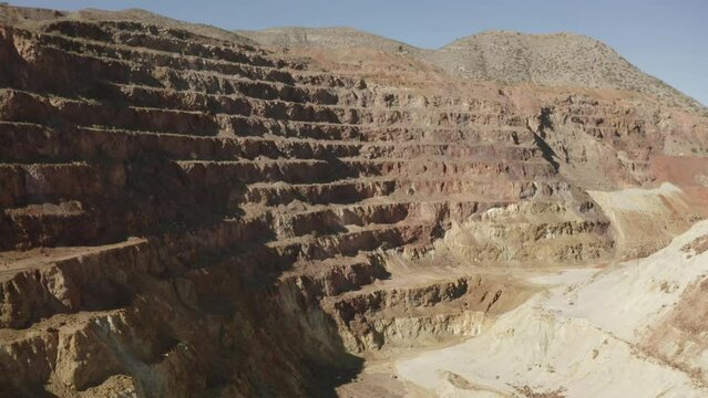 Aerial flight over the Queen mine in Bisbee Arizona.  This is an very large open pit mine.