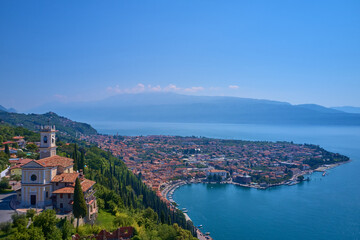 Fototapeta na wymiar Chiesa di Montemaderno on a hill overlooking the town of Toscolano Maderno on Lake Garda in Italy.