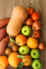 Various healthy fruit and vegetable on wooden background. Top view.