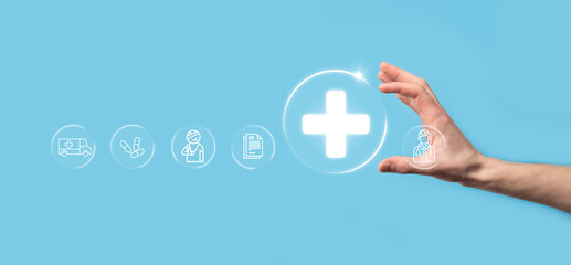 Businessman hold virtual plus medical network connection icons. Covid-19 pandemic develop people...