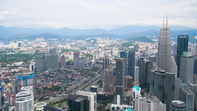 Kuala Lumpur, Malaysia - December 27, 2019: Panoramic aerial view of Petronas Twin Towers and city skyline