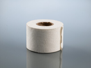 Plaster white in a roll on a gray background