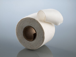 Plaster white in a roll on a gray background