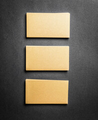 Stack of golden business cards with blank space. Mock up of business template.