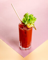 Cold alcoholic or non-alcoholic cocktail on pastel background. Hard light, deep shadow.