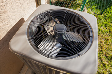 Modern residential HVAC air conditioner unit fan.